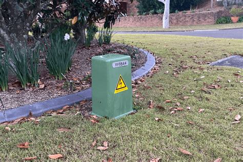 green electric box outside|green electricity box outside house.